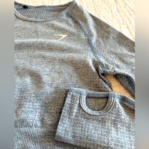Gymshark LIKE NEW! cropped long sleeve with thumb holes. Pretty blue, size XS